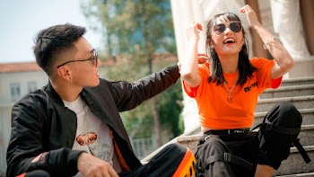 Photo of Man and Woman Sitting Near Each Other