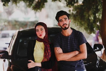 Photo of Man and Woman Standing Close To Each Other