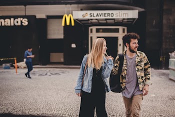 Photo of Man and Woman Standing Near Mcdonald's
