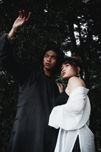 Photo of Man and Woman Surrounded by Trees