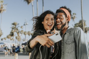 Photo of Man and Woman Taking Selfie