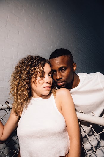 Photo of Man and Woman Wearing White Top