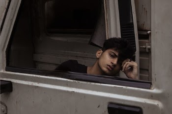 Photo of Man Behind Car Door