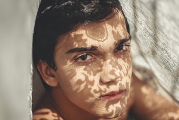 Photo Of Man Beside Lace Fabric