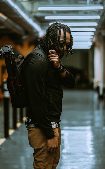 Photo of Man Carrying Backpack