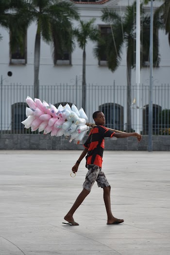Photo Of Man Carrying Cotton Candies