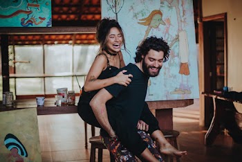Photo of Man Carrying Woman