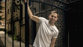 Photo Of Man Clinging On A Gate