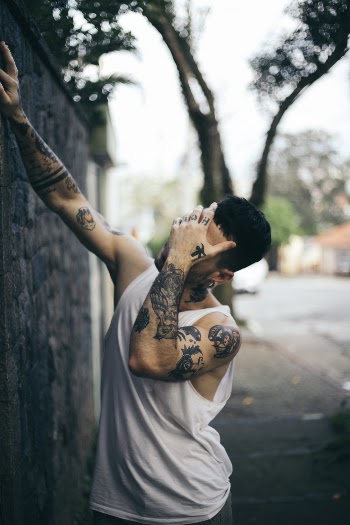 Photo of Man Covering His Face