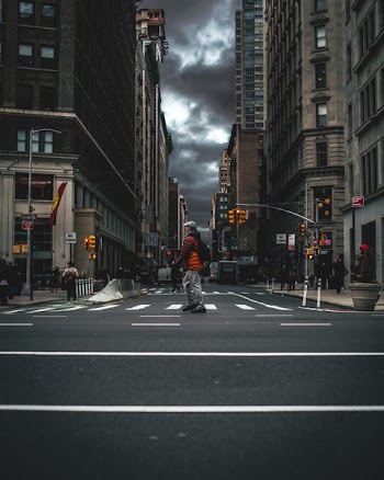 Photo of Man Crossing the Sreet