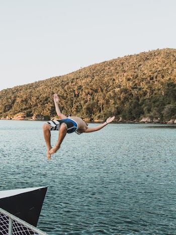 Photo of Man Diving on Lake