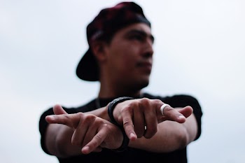 Photo of Man Doing Hand Signs