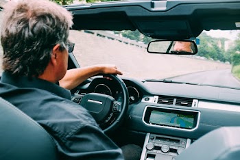 Photo of Man Driving a Convertible Vehicle