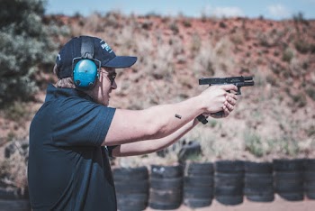 Photo of Man Firing Pistol