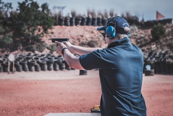 Photo of Man Firing Pistol