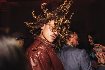 Photo of Man Flipping His Hair