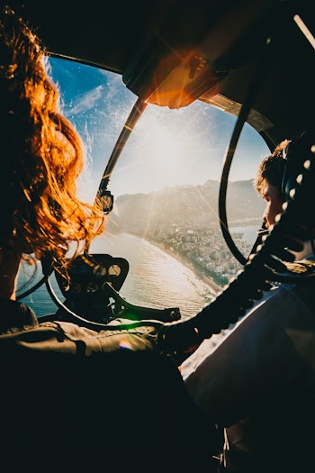 Photo of Man Flying a Helicopter
