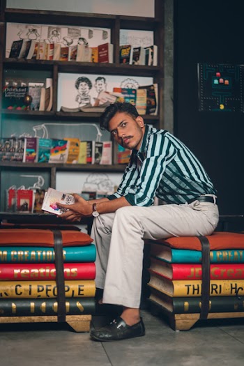 Photo of Man Holding a Book
