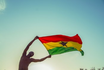 Photo of Man Holding A Flag