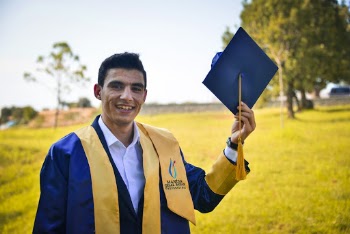 Photo Of Man Holding A Graduation Cap