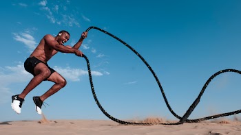 Photo of Man Holding Black Rope
