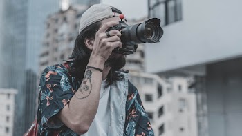 Photo of Man Holding Camera