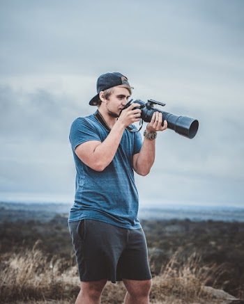 Photo of Man Holding Camera