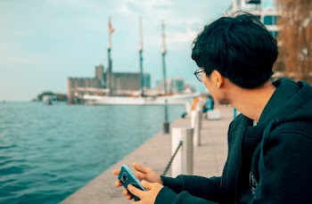 Photo of Man Holding Cellphone