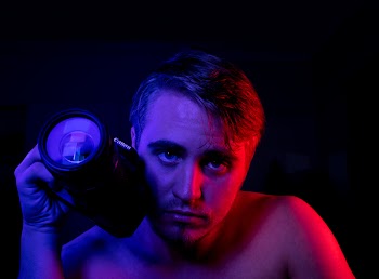 Photo of Man Holding DSLR Camera
