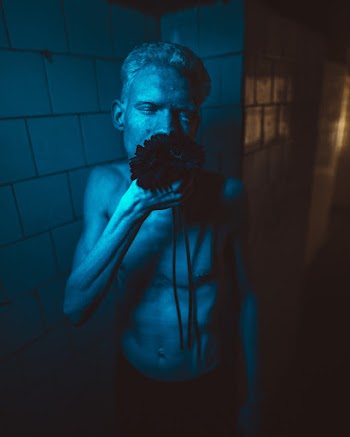 Photo Of Man Holding Flower