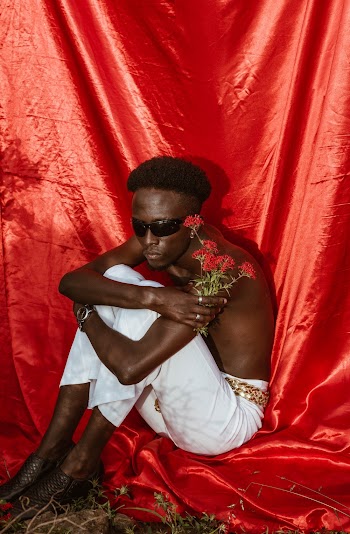 Photo Of Man Holding Flowers
