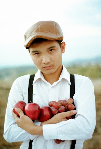 Photo Of Man Holding Fruits