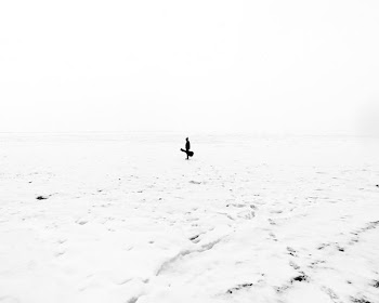 photo of man holding guitar