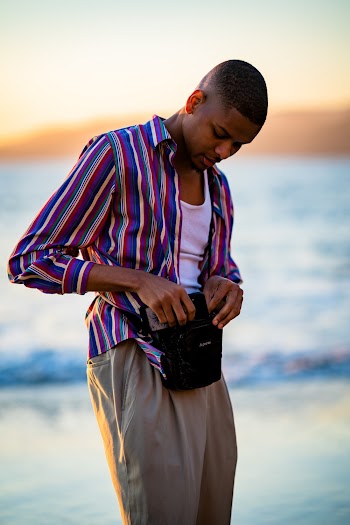 Photo Of Man Holding His Bag