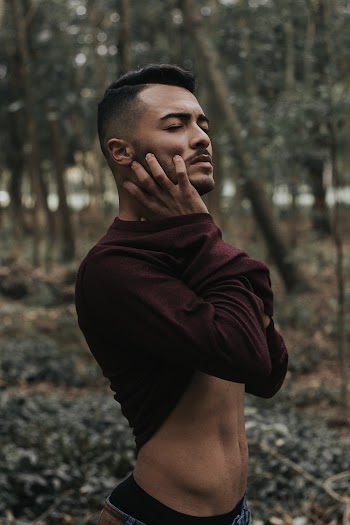 Photo of Man Holding His Cheek