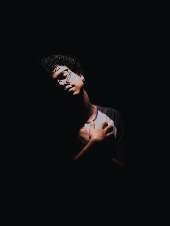 Photo of Man Holding His Chest