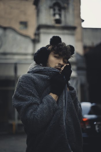 Photo Of Man Holding His Jacket