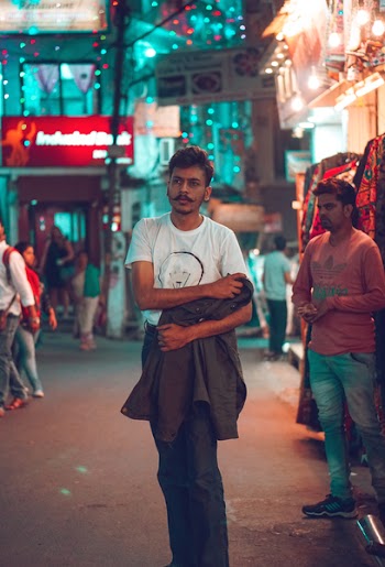 Photo of Man Holding His Jacket