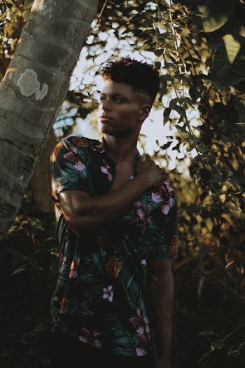 Photo of Man Holding His Left Shoulder