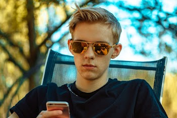Photo Of Man Holding His Phone 
