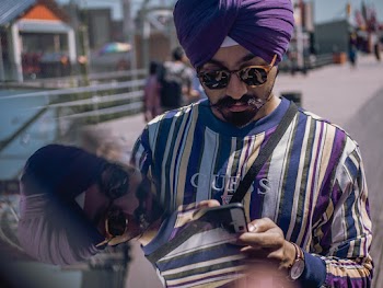 Photo Of Man Holding His Phone