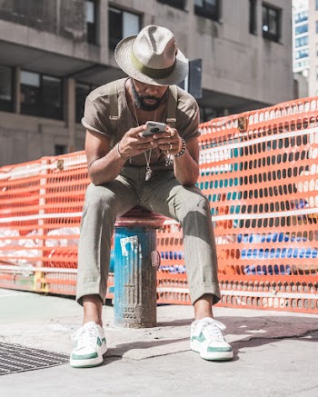 Photo Of Man Holding His Smartphone