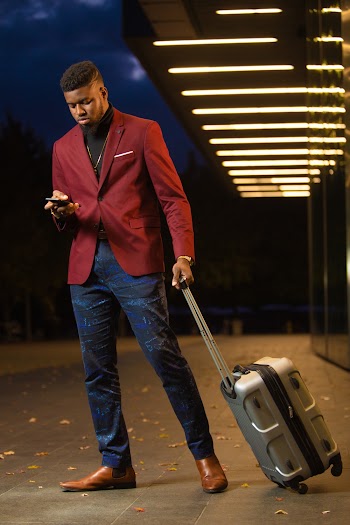 Photo Of Man Holding Luggage Bag