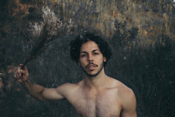 Photo of Man Holding Plants