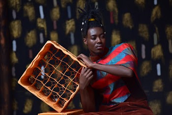 Photo of Man Holding Plastic Bottle Crate