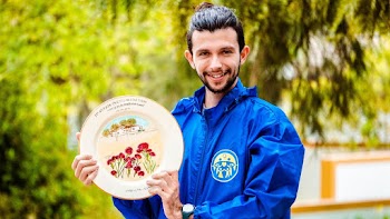 Photo of Man Holding Plate