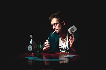 Photo of Man Holding Playing Card