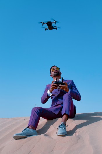 Photo of Man Holding Remote Control