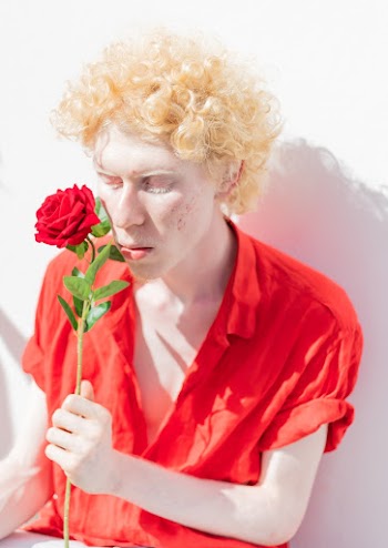Photo of Man Holding Rose