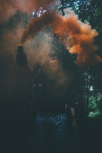 Photo Of Man Holding Smoke Bomb